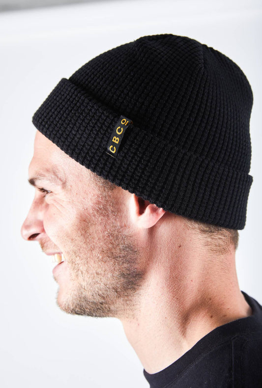 Man is wearing a Colonial Brewing Co, CBCO X BILLY BONES BEANIE in black